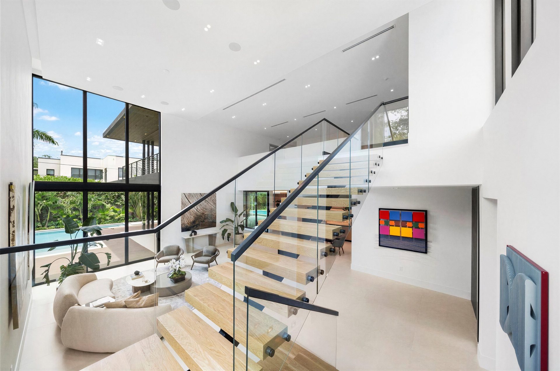 Floating staircase with living area and pool views